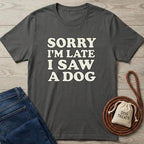 Charcoal gray cotton t-shirt with "SORRY I'M LATE I SAW A DOG" in cream text.