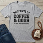 Heather gray t-shirt with "University of Coffee & Dogs" graphic, next to jeans, a leash, and dog treats.