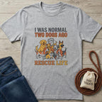 Gray cotton t-shirt with "I WAS NORMAL TWO DOGS AGO RESCUE LIFE" text and cartoon dogs.