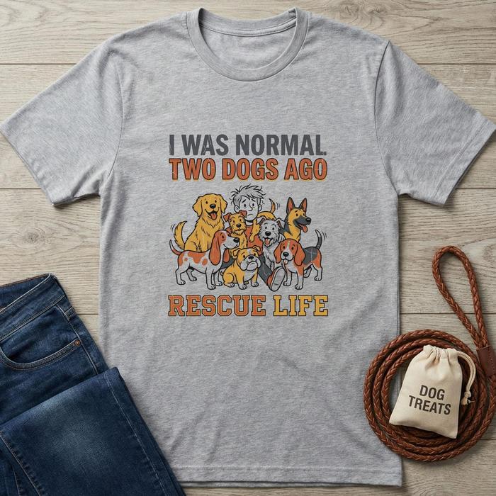 Gray cotton t-shirt with "I WAS NORMAL TWO DOGS AGO RESCUE LIFE" text and cartoon dogs.
