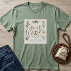Sage green cotton t-shirt with a detailed illustration of a golden retriever surrounded by various flowers.