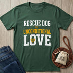 Forest green "Rescue Dog = Unconditional Love" t-shirt with a paw print heart, next to jeans and dog treats.