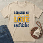 Beige cotton t-shirt with "God Sent Me Unconditional Love In A Rescue Dog" text in blue and gold.