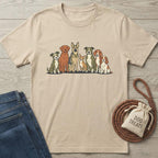 Beige cotton t-shirt with a colorful graphic of seven different dog breeds in a line.