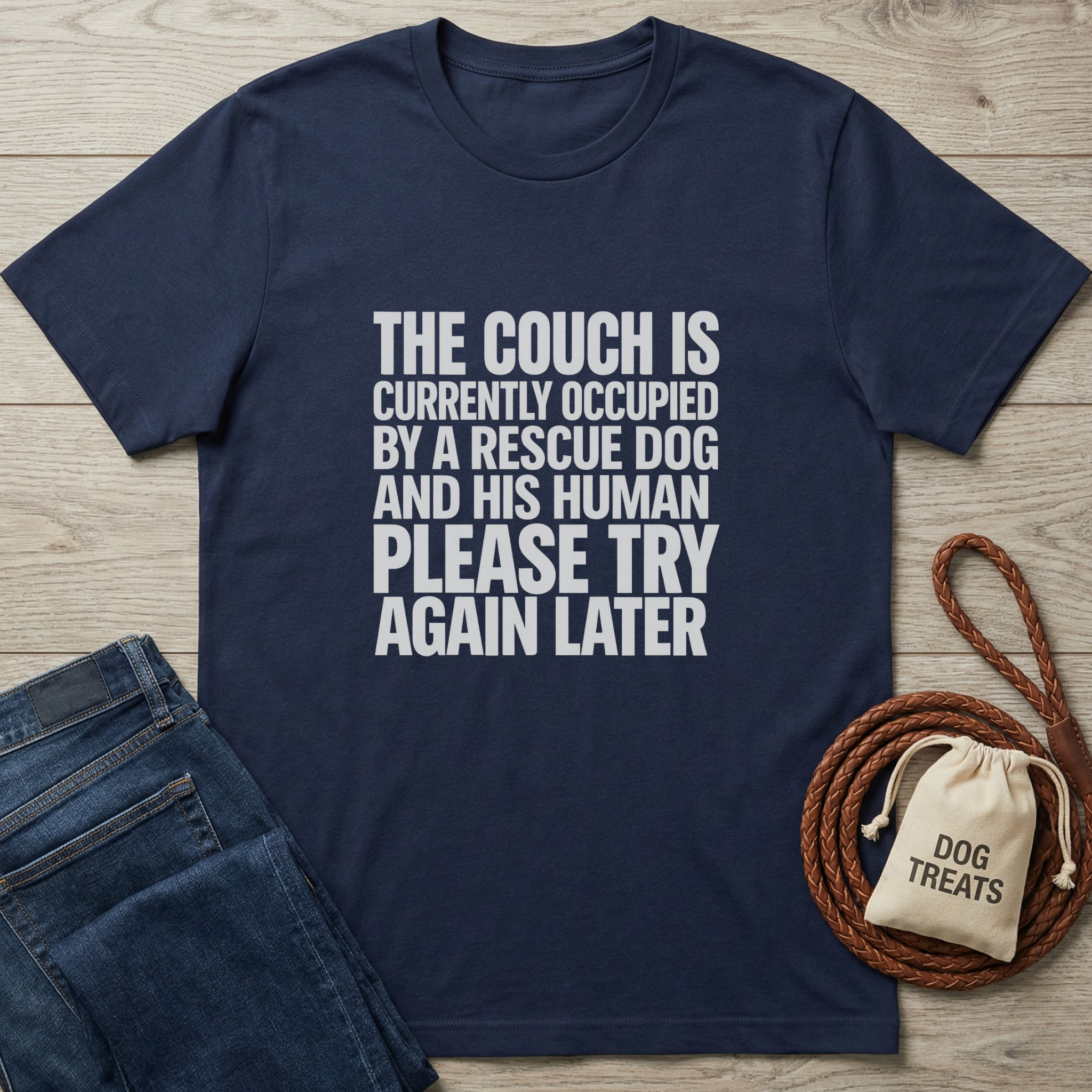 Navy blue cotton t-shirt with "The Couch Is Currently Occupied By A Rescue Dog And His Human Please Try Again Later" text.