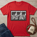 Red cotton t-shirt with "ADOPT DON'T SHOP EXPLICIT LOYALTY" text and paw prints.