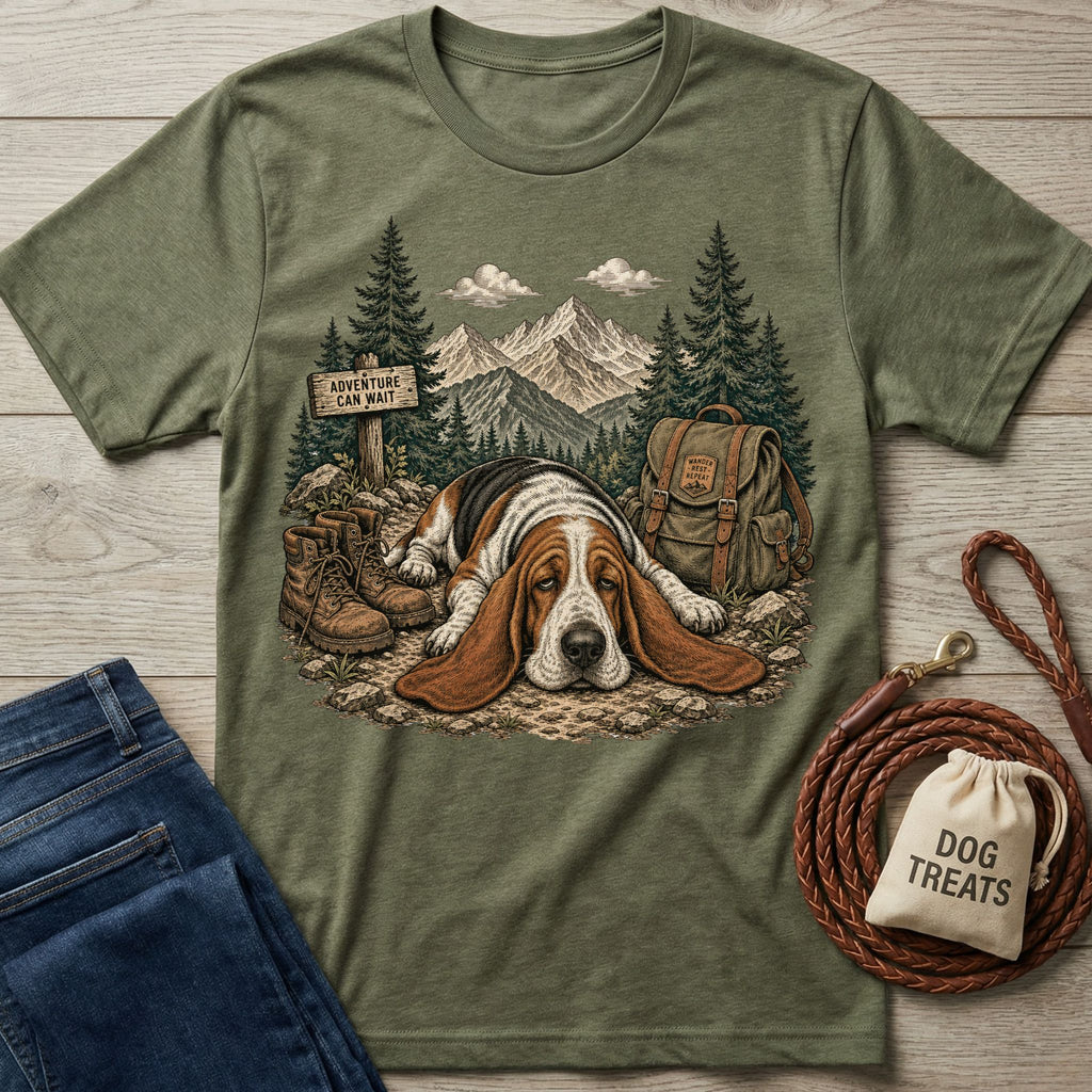 Olive green crewneck t-shirt featuring a graphic of a tired Basset Hound resting on a mountain trail with hiking gear.