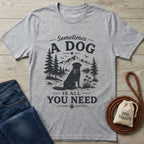Light grey Gildan Softstyle® t-shirt with "Sometimes A Dog Is All You Need" graphic featuring a rescue dog in a mountain landscape.
