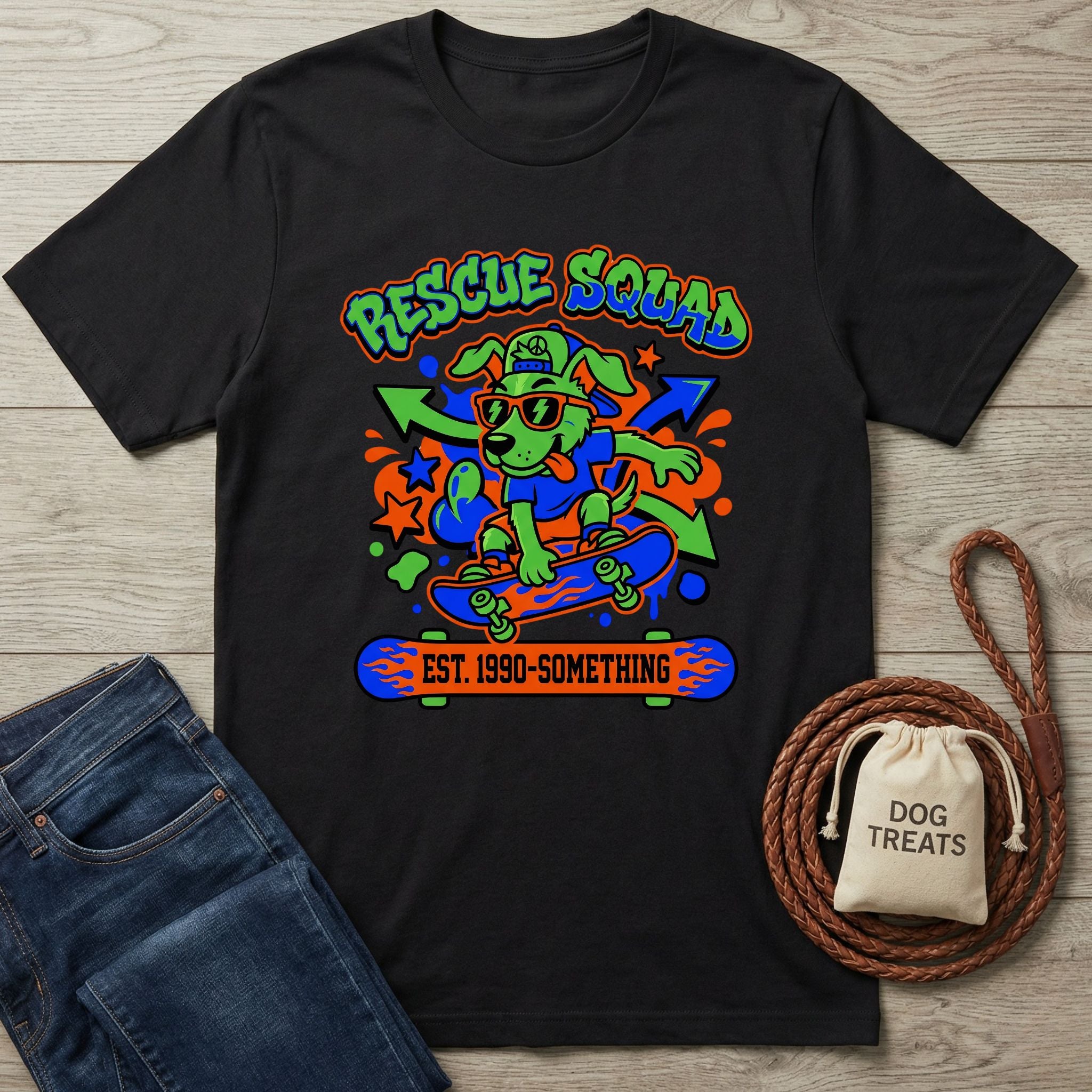 Black cotton t-shirt with a vibrant 90s-style graphic of a dog skateboarding, "Rescue Squad" text.
