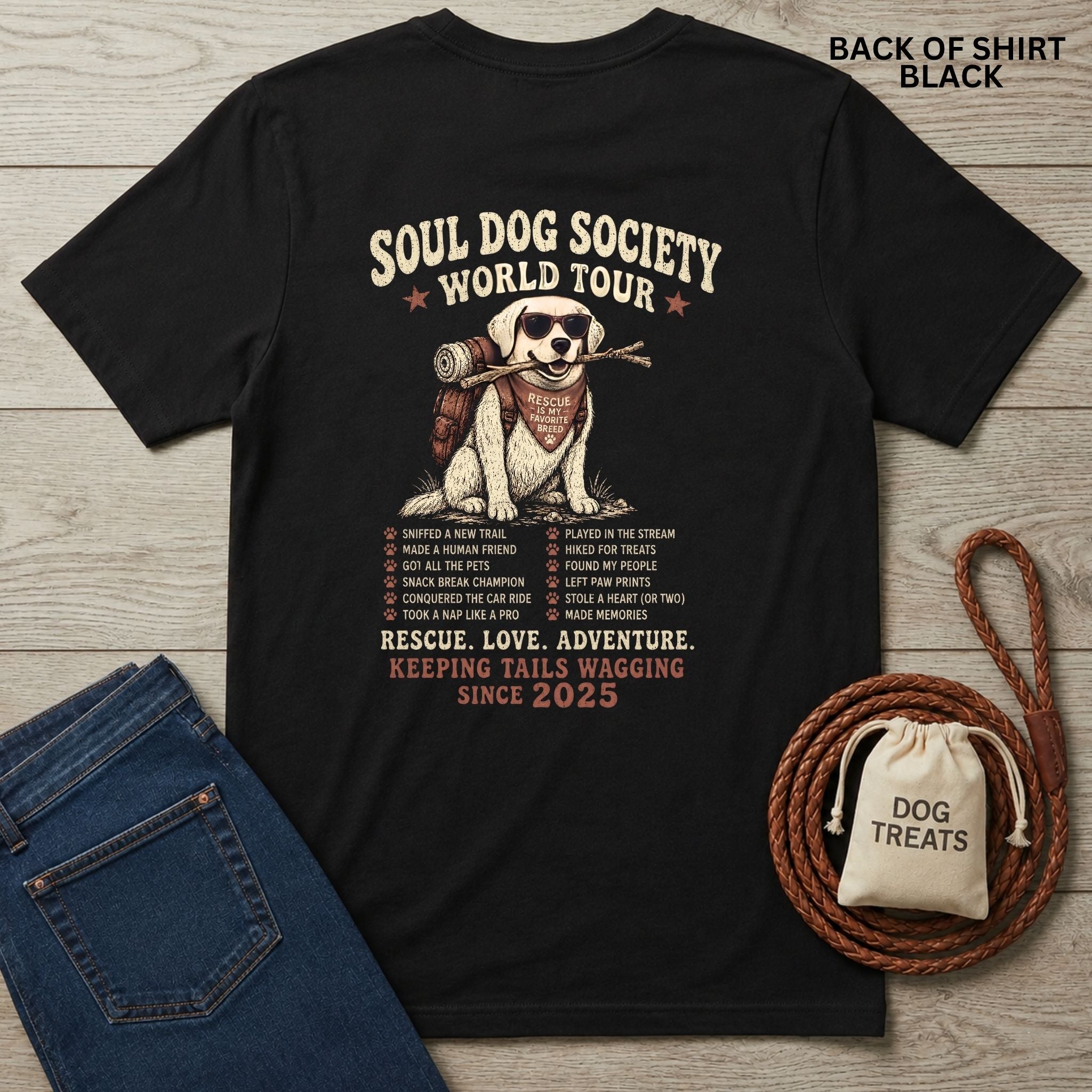 Black Soul Dog World Tour T-shirt with a graphic of a dog wearing sunglasses and a backpack, plus a list of dog adventures.