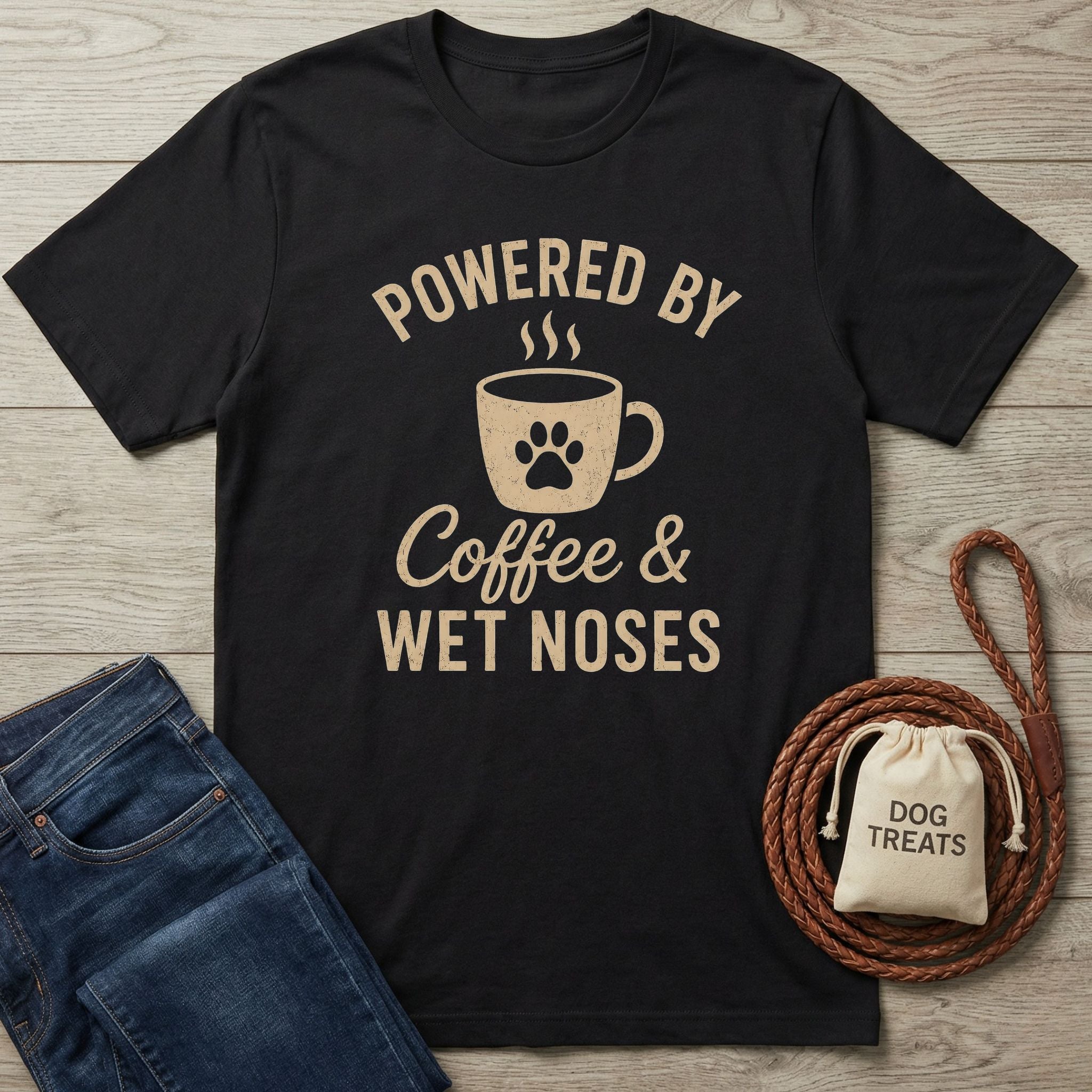 Black t-shirt with "Powered by Coffee & Wet Noses" text, coffee mug, and paw print graphic.