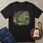 Black cotton t-shirt with a sleeping dog, waterfall, and ferns graphic.