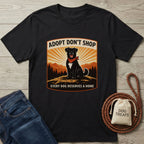 Black Gildan Softstyle t-shirt with "Adopt Don't Shop" graphic featuring a black lab in a red bandana.