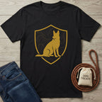 Black t-shirt with a gold shield emblem featuring a sitting canine silhouette and topographic lines.