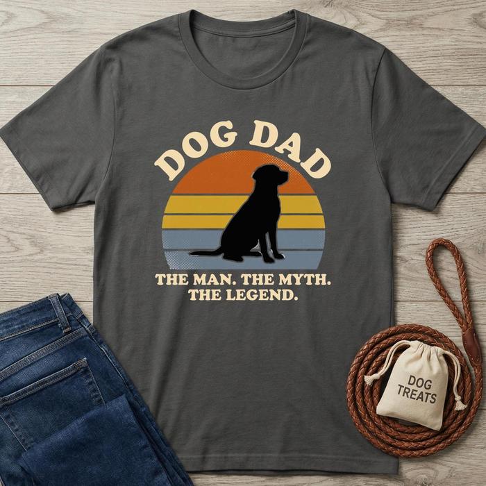 Charcoal grey cotton Dog Dad t-shirt with a black lab silhouette against a sunset design and "The Man, The Myth. The Legend." text.