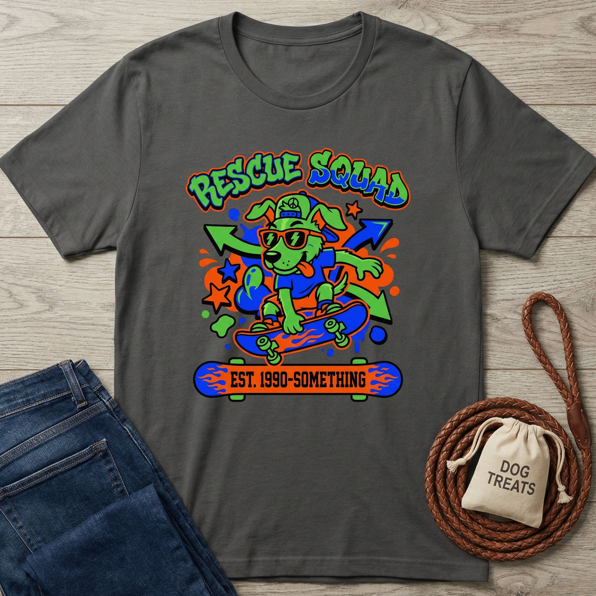 Dark gray cotton tee with a vibrant 90s-style "Rescue Squad" dog on a skateboard graphic.