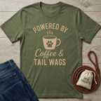 Olive green t-shirt with "Powered by Coffee & Tail Wags" design featuring a paw print coffee mug.