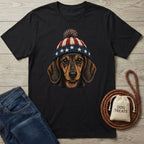 Black cotton t-shirt with a patriotic dachshund wearing a red, white, and blue star-spangled beanie.