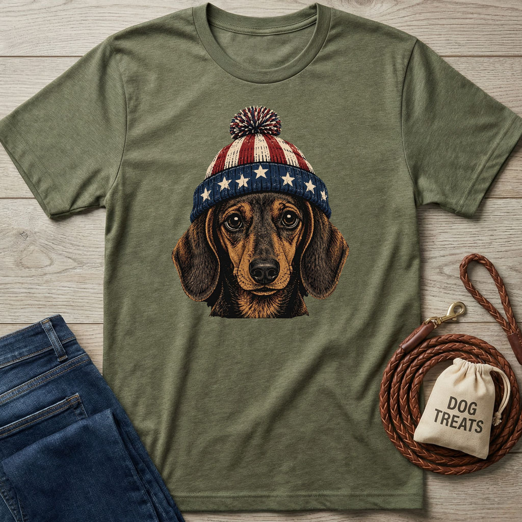 Olive green tee with vintage patriotic dachshund wearing a stars and stripes pom-pom hat.