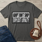 Charcoal gray cotton t-shirt with "ADOPT DON'T SHOP EXPLICIT LOYALTY" text and paw prints.