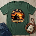 Dark green Golden Souls T-shirt with a graphic of a person and dog watching a sunset over a lake.