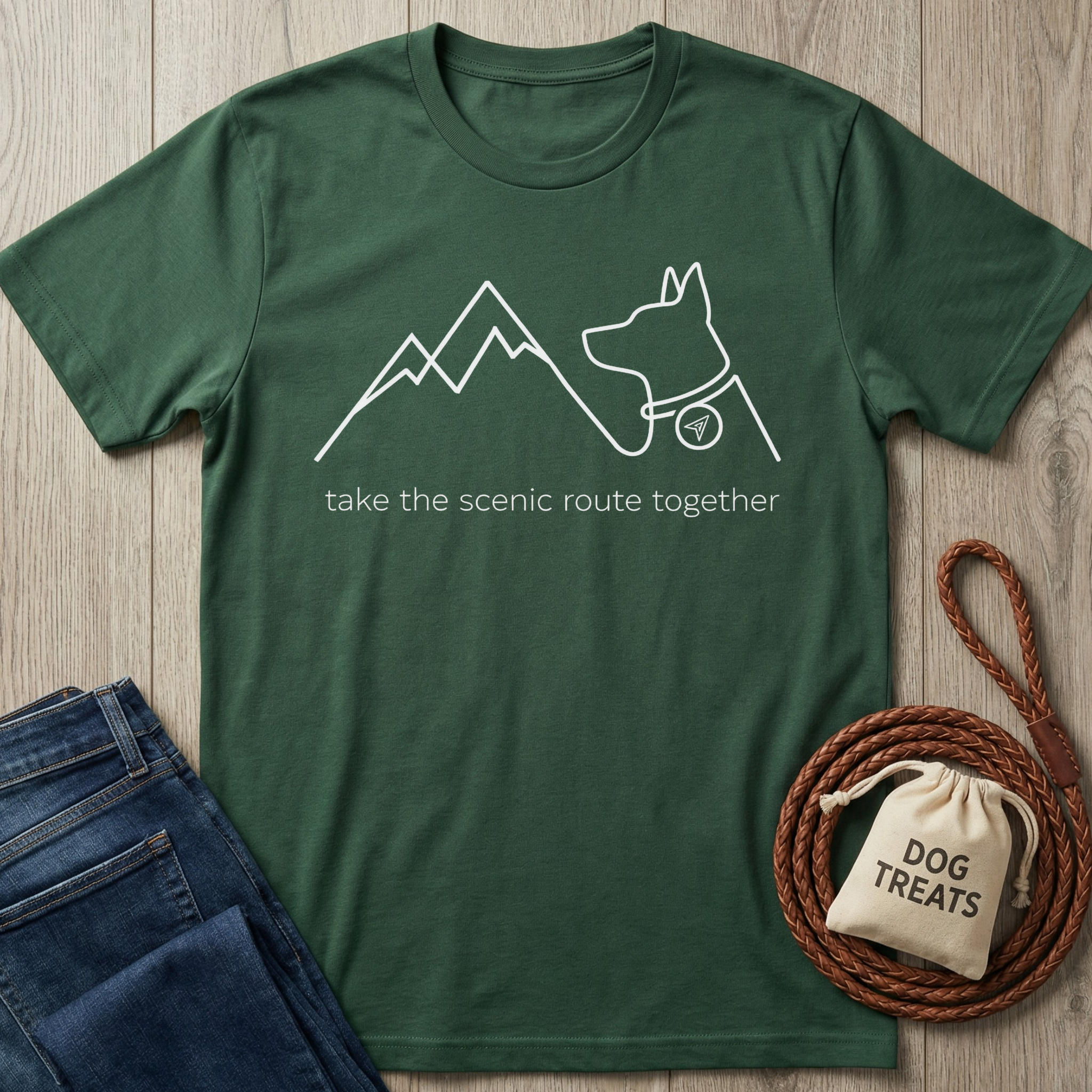 Dark green cotton t-shirt with white outline of mountains, a dog, and "take the scenic route together" text.
