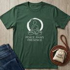 Dark green cotton t-shirt with "Peace Paws Presence" text and a meditating person with a dog graphic.