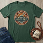 Forest green cotton t-shirt with "Rescue Dog Adventure Club" logo, jeans, and dog treats bag.