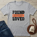 Light grey Gildan Softstyle t-shirt with "FOUND CHOSEN LOVED" text, paired with jeans and dog treats.
