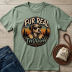 Sage green cotton t-shirt featuring a vintage-style graphic of a dog in sunglasses with the text Fur Real Though.