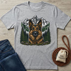 Grey crewneck t-shirt featuring a detailed German Shepherd portrait against a mountain and pine forest landscape.