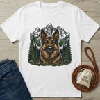 White cotton t-shirt featuring a detailed German Shepherd portrait against a mountain and pine forest landscape.