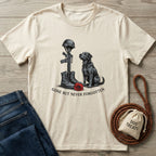 Cream Gildan Softstyle® t-shirt with a black dog, military boots, rifle, helmet, and red poppy graphic.