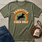 Olive green Pawsitive Vibes Only t-shirt with a jumping dog silhouette over a retro rainbow.