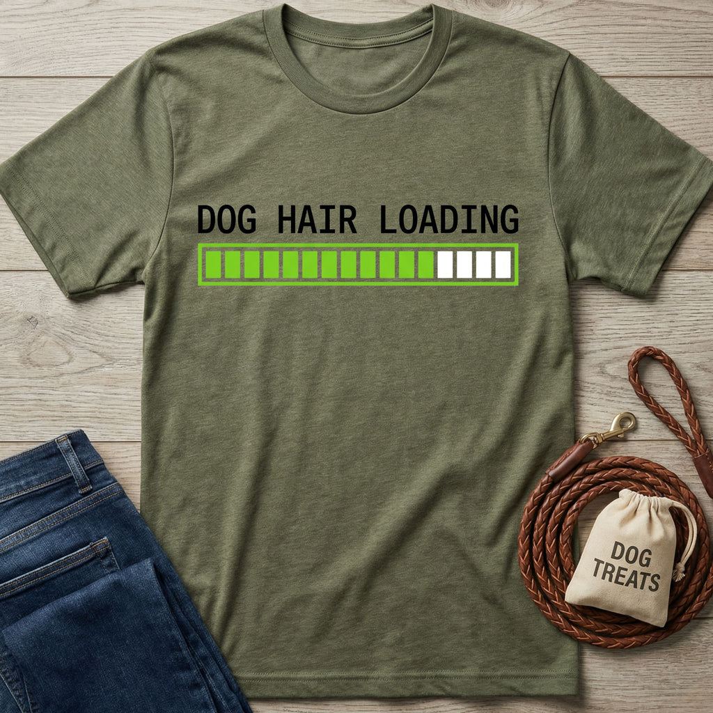Olive green t-shirt with "DOG HAIR LOADING" text and a green progress bar, next to jeans and dog accessories.