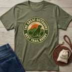 Olive green Gildan Softstyle® t-shirt with "The Great Outdoors Best Trail Buddy" graphic featuring a dog, mountains, and sunset.