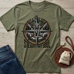 Olive green t-shirt with a compass design featuring a dog, mountains, trees, and "Steady My Soul" text.