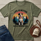 Olive green Gildan Softstyle® t-shirt with "Life is Better With a Rescue Dog" graphic, featuring a happy dog, mountains, and trees.