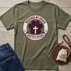 Olive green t-shirt with "Rescued By Grace, Adopted & Blessed" paw print design.