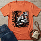 Orange "Unleashed" T-shirt with a jumping dog graphic, paired with jeans and dog accessories.