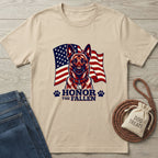 Beige Gildan Softstyle t-shirt with a German Shepherd, American flag, "Honor The Fallen" text, and paw prints.