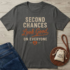 Charcoal gray crewneck t-shirt with Second Chances Look Good on Everyone text and a paw print heart design.