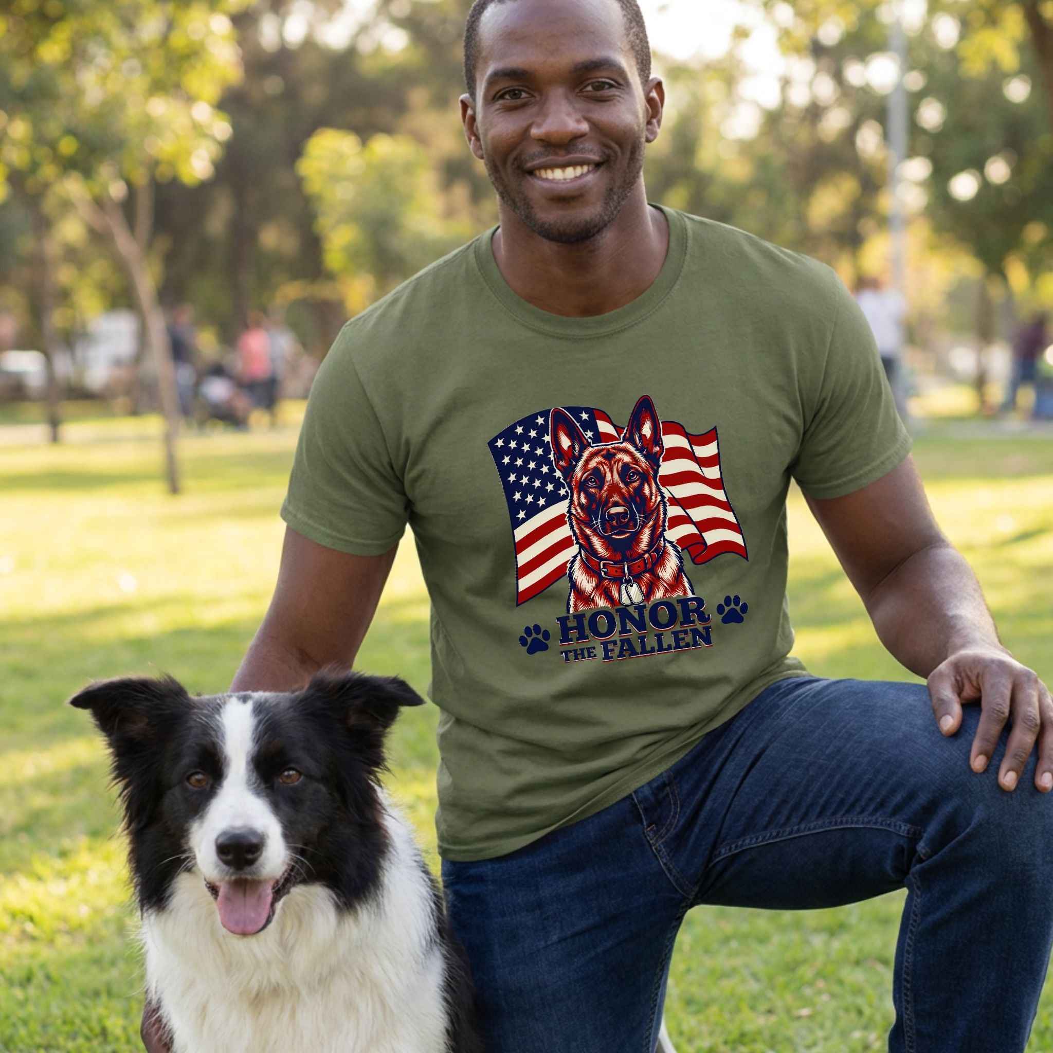 Man in olive green "Honor The Fallen" t-shirt with German Shepherd and American flag design, kneeling with a Border Collie.