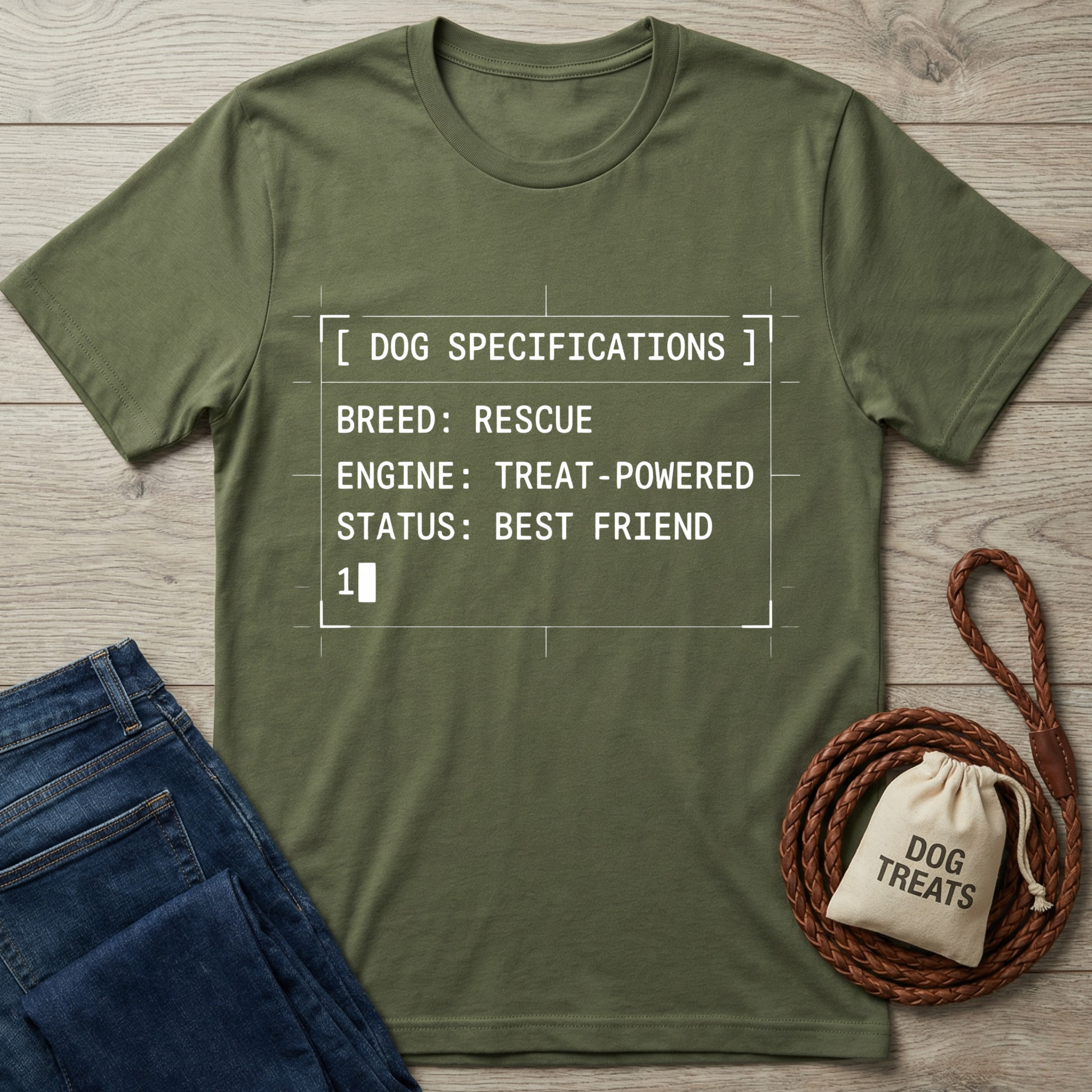 Olive green Gildan Softstyle t-shirt with "Dog Specifications" text, jeans, and a treat bag.