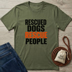 Olive green Gildan Softstyle t-shirt with "RESCUED DOGS RESCUE PEOPLE" text, paired with jeans and dog treats.