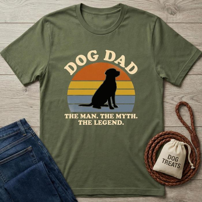 Olive green cotton Dog Dad t-shirt with a black dog silhouette against a sunset graphic.