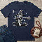 Navy blue crewneck t-shirt featuring a white graphic of a dog in a witch hat holding a broomstick in a pumpkin patch.