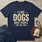 Navy Gildan Softstyle® 64000 tee with "I LIKE DOGS MOST PEOPLE ARE OK TOO" text, jeans, and dog treats.