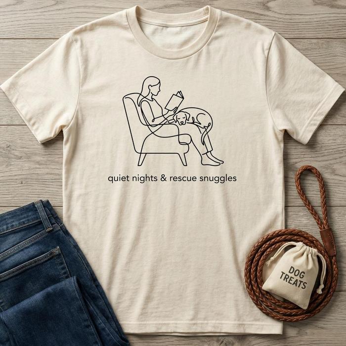 Cream t-shirt with "quiet nights & rescue snuggles" text and line art of a person reading with a dog.