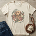 Cream Gildan Softstyle t-shirt with a golden retriever surrounded by pink and cream flowers, "Kind Heart Brave Soul" text.